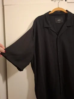 House Black short sleeved buttonup loose fit