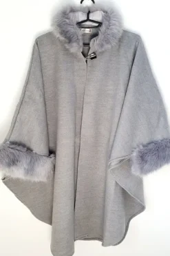 Outlet poncho with a faux fur trim on the hood and cuffs.