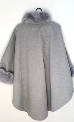 Outlet poncho with a faux fur trim on the hood and cuffs.